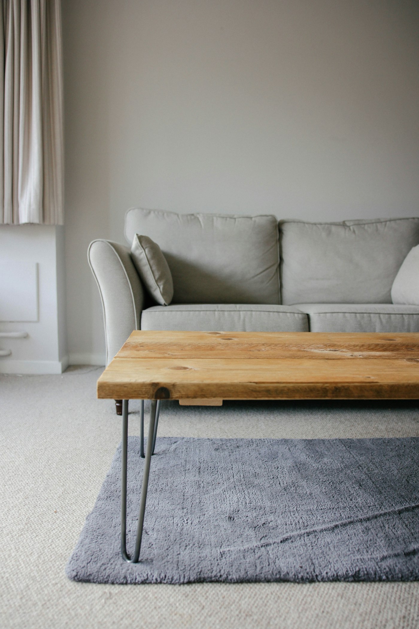Live-edge solid wood low table on slim steel legs