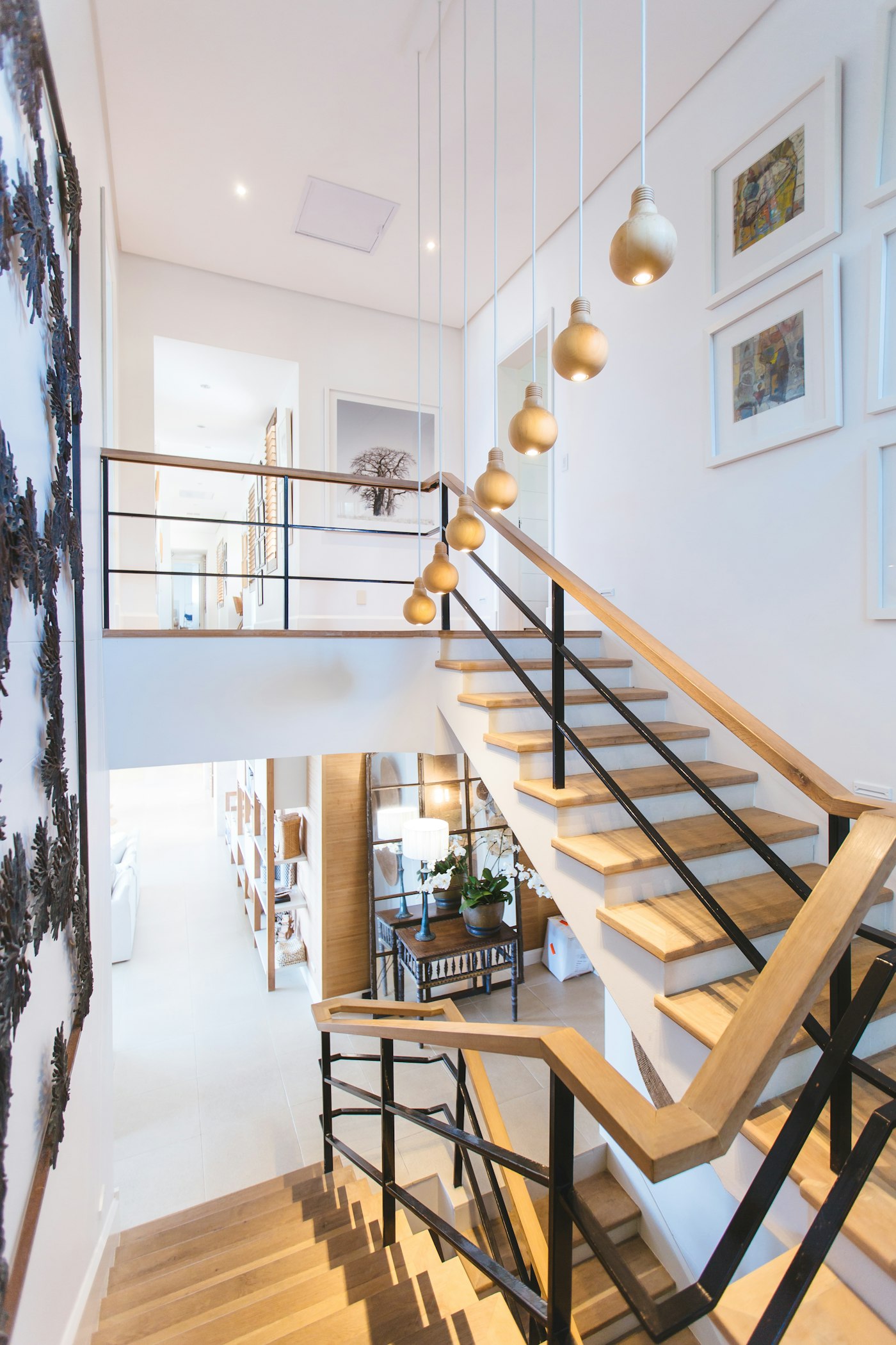 Open staircase with solid oak treads and a blackened steel balustrade